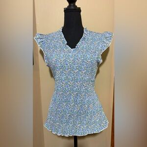 Floral ruffle neck and sleeves smocked top. NWOT. Size L.